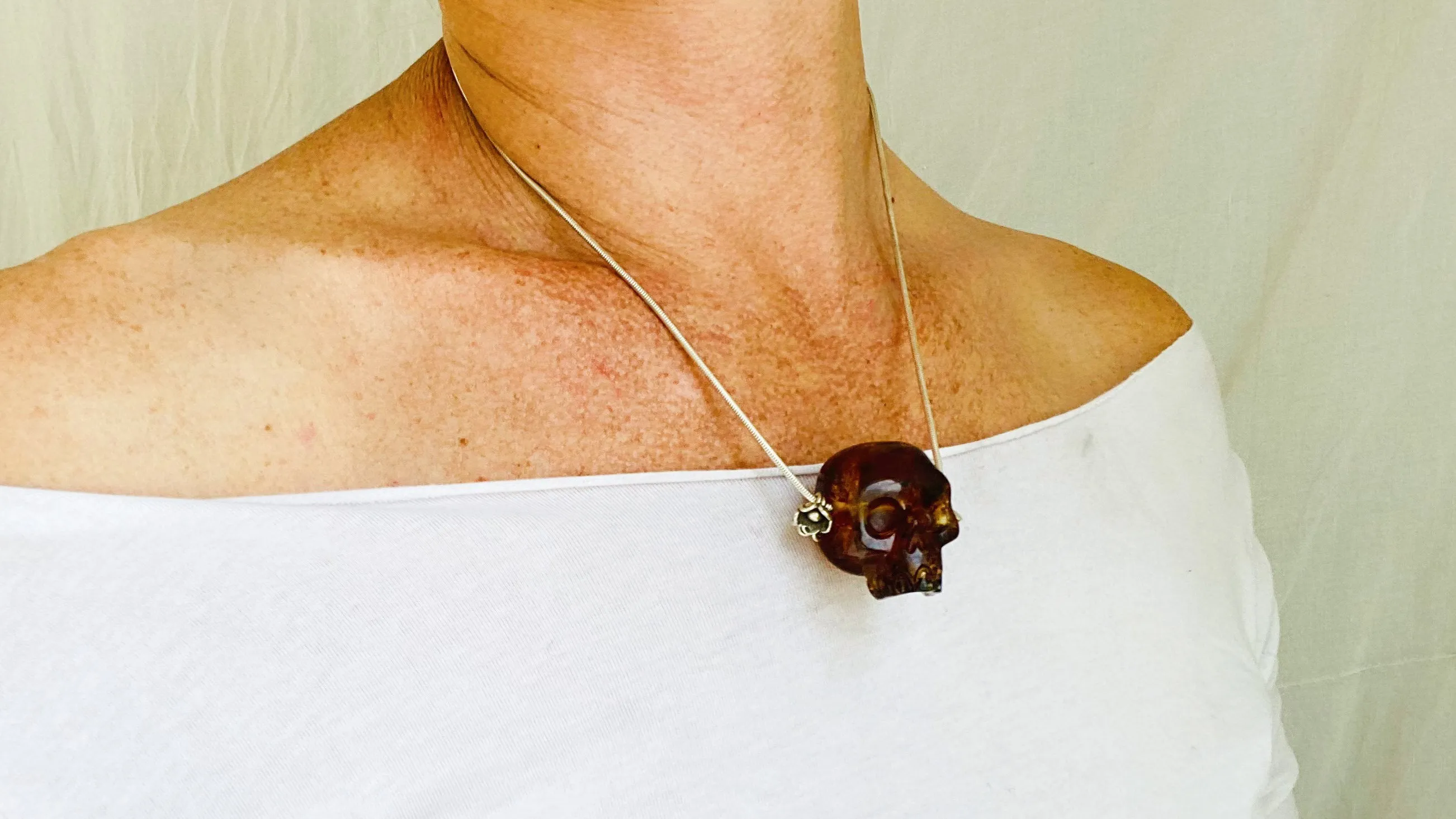 Amber Skull Pendant on Sterling Silver Snake Chain.