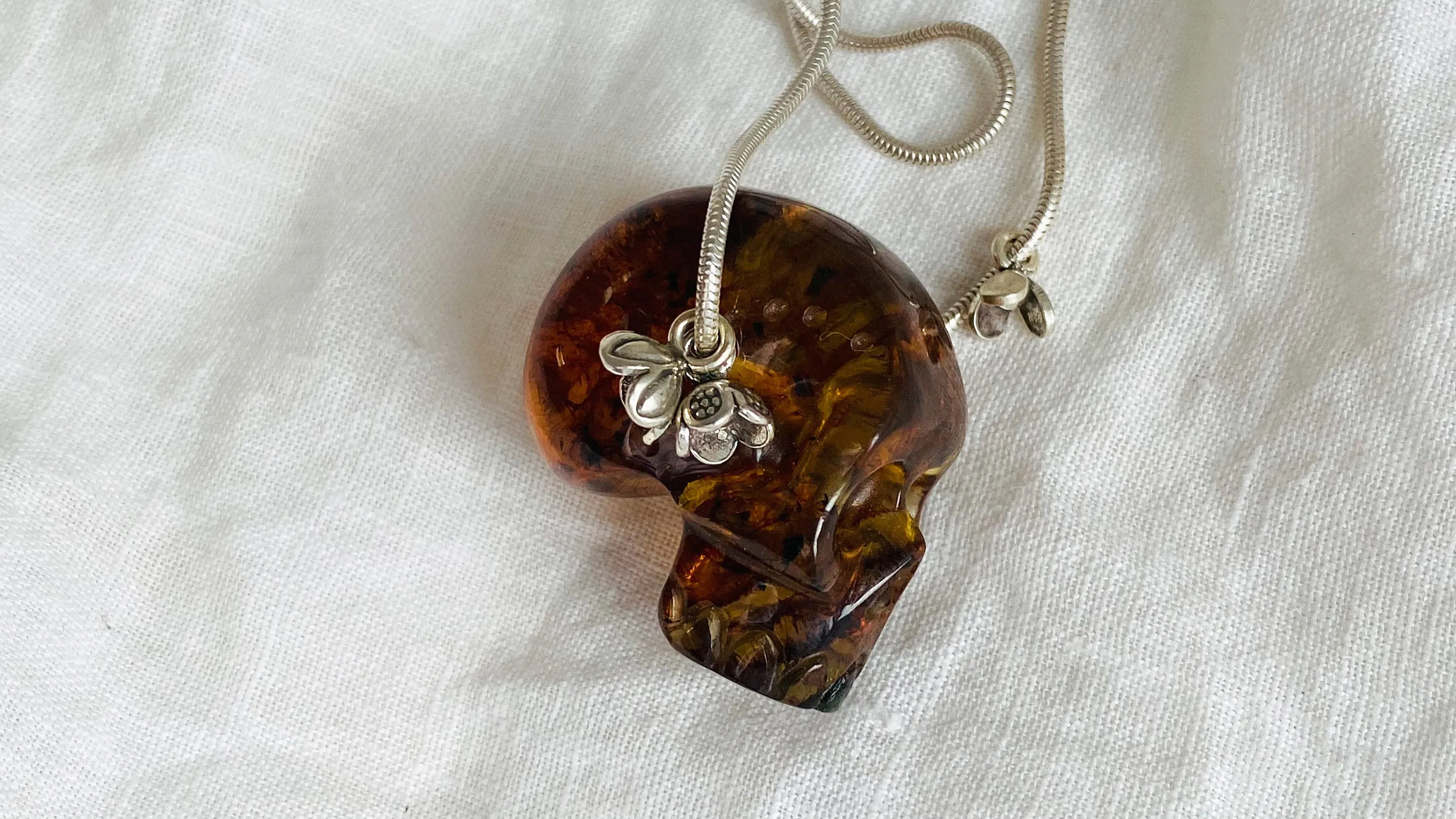 Amber Skull Pendant on Sterling Silver Snake Chain.