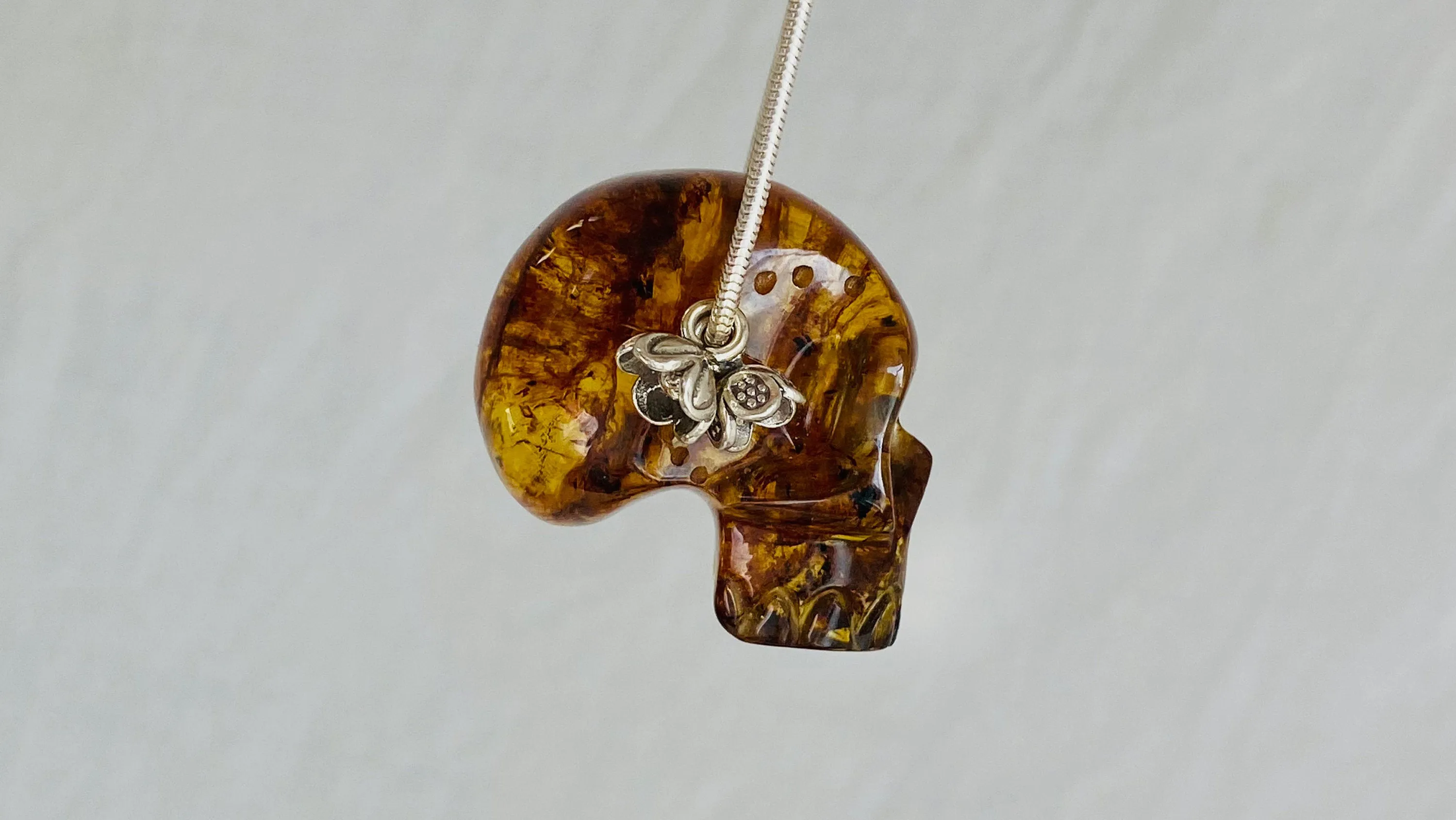 Amber Skull Pendant on Sterling Silver Snake Chain.